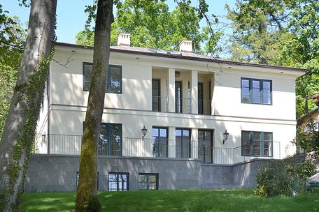 Stately lakeside villa with exquisite furnishings and swimming pool on sunny lakefront property