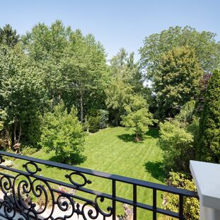 View from the balcony into the secluded garden