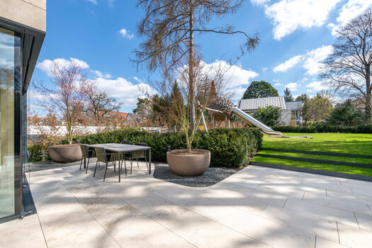 Sunny terrace with natural stone tiles