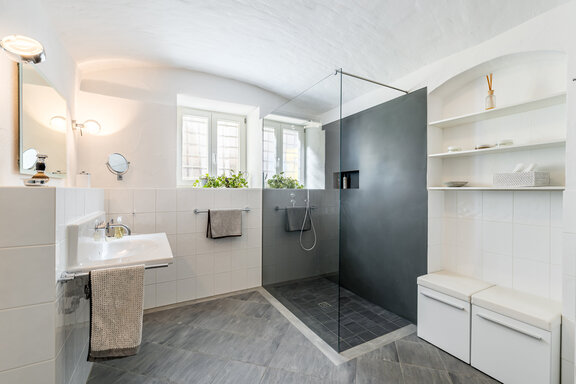 Spacious shower room with plenty of natural light