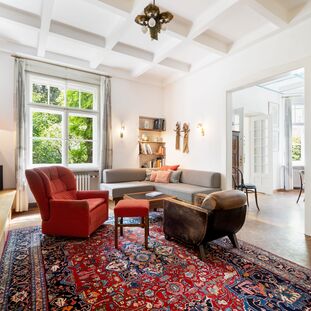 Living area with a tiled stove