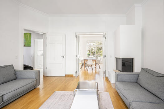 Spacious living/dining area with open fireplace
