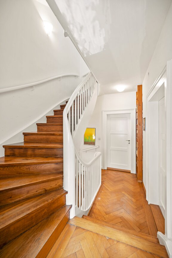 An ornate staircase as the centerpiece of the house
