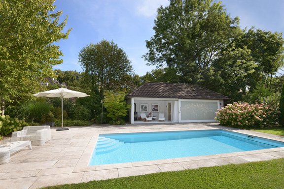 Spectacular pool house with sliding window front