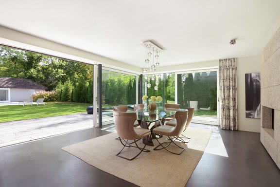 Dining area with open fireplace and panoramic windows