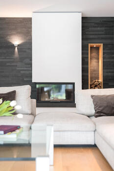 Modern fireplace with wood storage niche