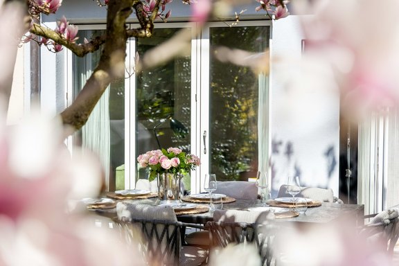 A large magnolia tree provides pleasant shade in the summer