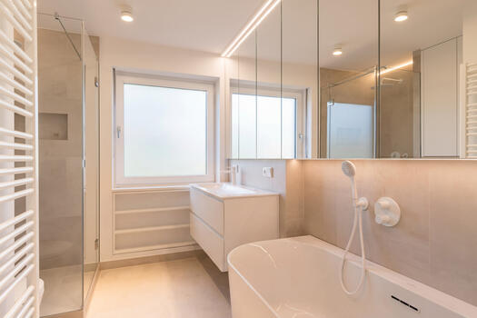 Bathroom with tub and shower