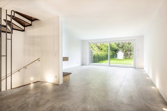 Living and dining area with fireplace and garden access