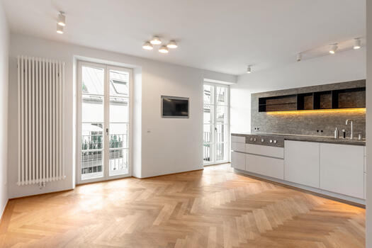 Fitted kitchen with natural stone worktop and brand-name appliances
