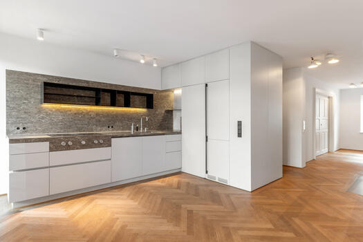 Fitted kitchen with open-plan living/dining area