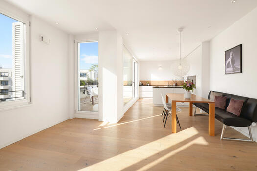 The open kitchen and dining area go hand in hand