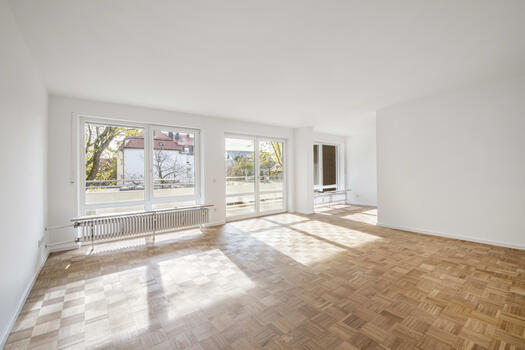 Bright living/dining area with balcony access