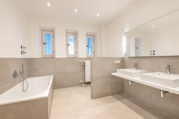 Master bathroom with bath and shower