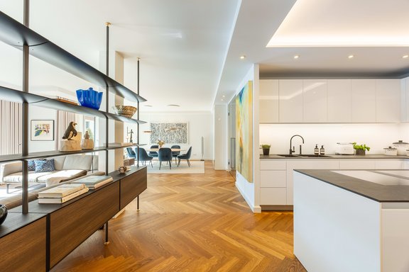 The living, dining, and kitchen area as the heart of the apartment