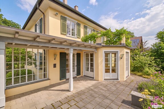 Patio with a glass-enclosed extension