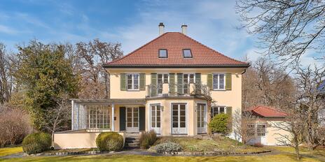 Classic 1928 villa with 6 bedrooms, plenty of charm, and a dream garden in a prime, unobstructed location