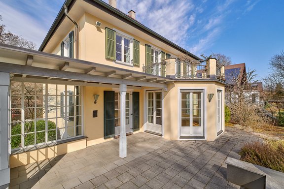 Patio with a glass-enclosed extension
