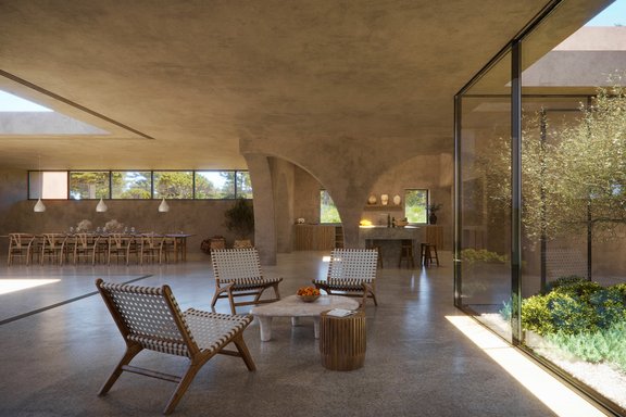 Imposante Glasfronten machen den mediterranen Garten zu einem Teil des Wohnens