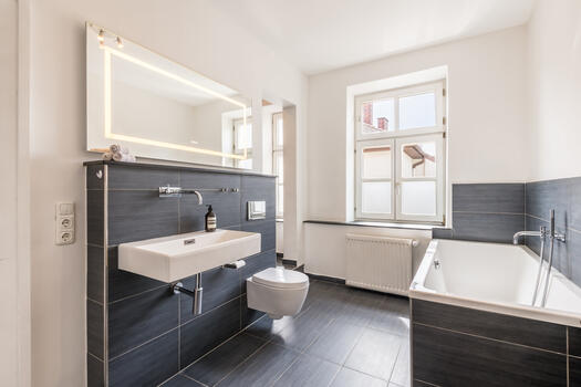 Bathroom with a tub and shower