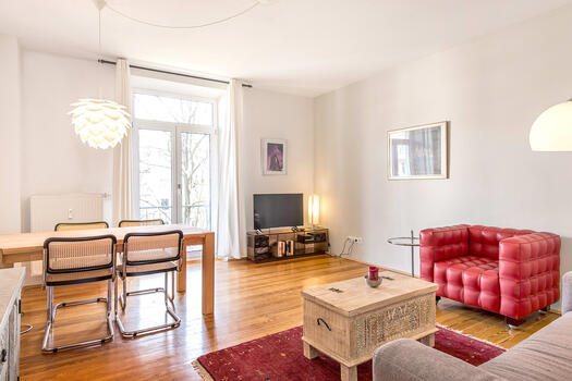 Bright, living and dining area with balcony