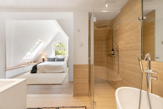 Master suite with bathroom and fireplace