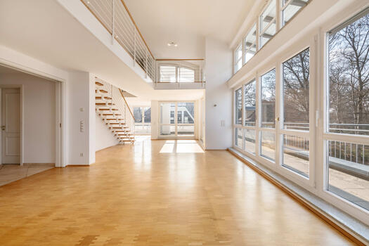 A light-filled penthouse with a loft area and a wraparound terrace