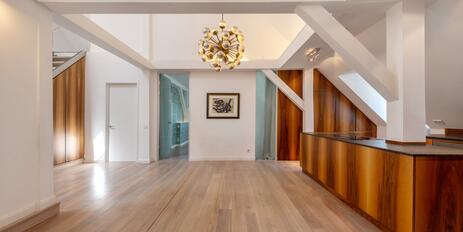 A bright and airy home in a prime location: a penthouse apartment with a corner tower in a palace built in 1899