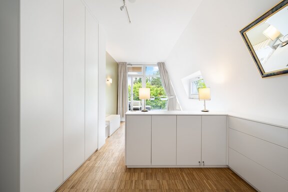 Master bedroom with a balcony