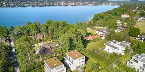 A prime location with lake views: Exclusive 3-bedroom penthouse with a fireplace, elevator landing, spa, and hobby areas