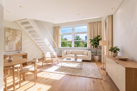 Exclusive attic apartment with gallery: spacious living area and south-facing windows, in need of renovation