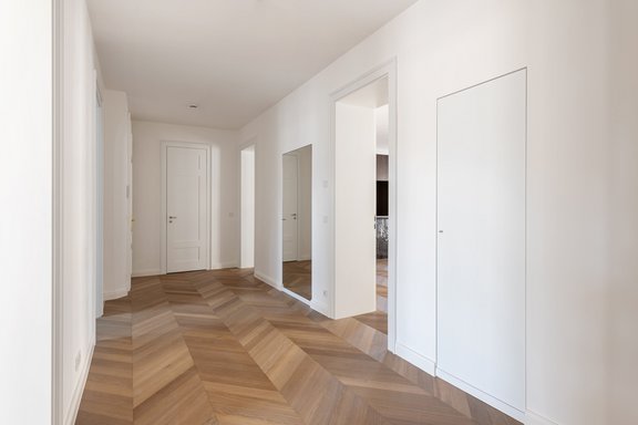 Hallway with practical built-in closets