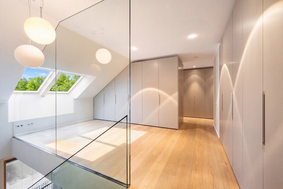 Elegant master suite featuring custom-made furniture by Molteni&C