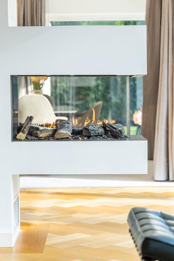 A decorative fireplace that defines the space