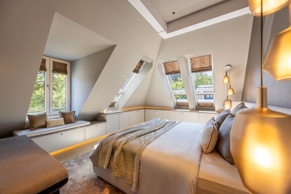 Master bedroom with a stylish window seat