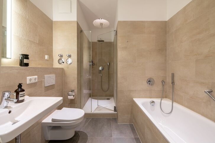 Bathroom with a tub and shower