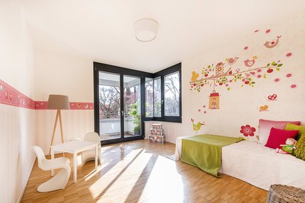 Children&#039;s room with large windows