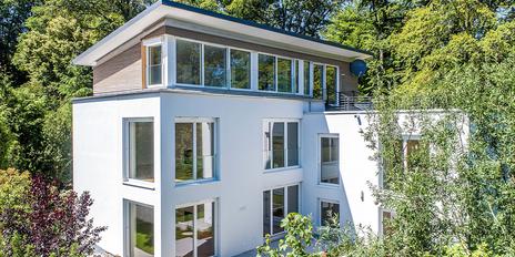 Modern rooftop duplex apartment with Alpine views and a "house within a house" feel