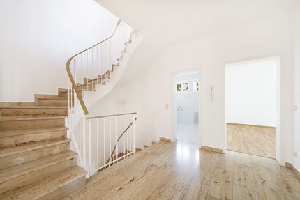 Hallway and staircase in light natural stone