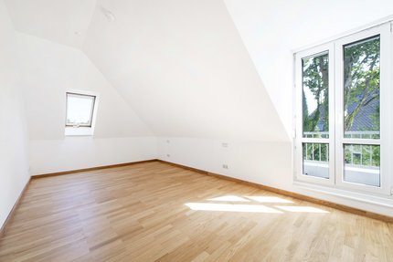 Bedroom with dormer windows and access to the roof terrace