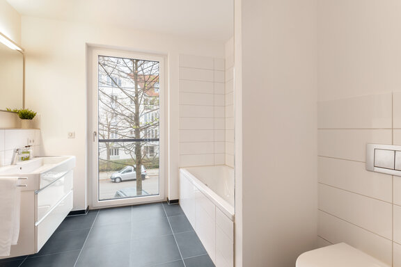 Bathroom with natural light and a bathtub