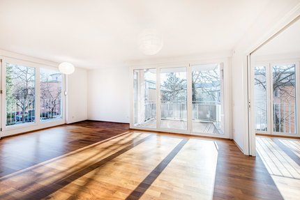 Living room with south balcony and east terrace
