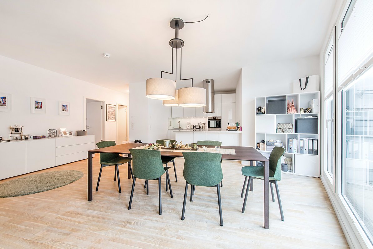 Dining area with open plan kitchen