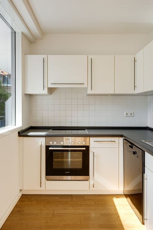 Bright kitchen with built-in appliances