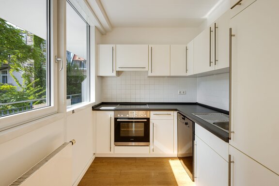 Bright kitchen with built-in appliances