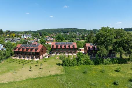 New build: mid-terrace house with private sunbathing island in an idyllic location and lake view