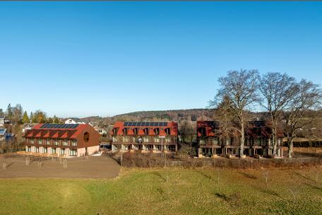 New build: mid-terrace house with private sunbathing island in an idyllic location and lake view