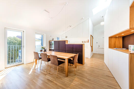 Open-plan dining area with adjoining kitchen