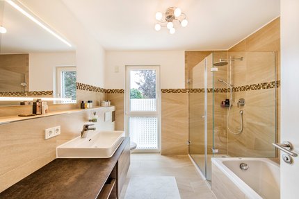 Natural stone bathroom with large shower