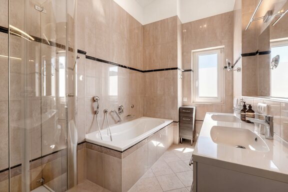 Bathroom with tub and shower